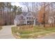 Desirable home with mature trees, a spacious lawn, and a long driveway at 659 Willard Dr, Creedmoor, NC 27522