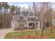 Beautiful home featuring mature trees, and classic architectural details at 659 Willard Dr, Creedmoor, NC 27522