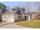 Stately home boasts an attached garage, manicured lawn, and charming architectural details at 659 Willard Dr, Creedmoor, NC 27522