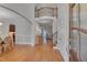 Open foyer with hardwood floors, staircase, and views of living and dining areas at 659 Willard Dr, Creedmoor, NC 27522