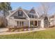 Charming home boasts a manicured lawn, stone accents, and a welcoming front porch at 659 Willard Dr, Creedmoor, NC 27522