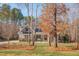 Beautiful home featuring manicured lawns, mature trees, and classic architectural details at 659 Willard Dr, Creedmoor, NC 27522