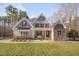 Charming home boasts a manicured lawn, stone accents, and a welcoming front porch at 659 Willard Dr, Creedmoor, NC 27522