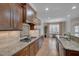 Open kitchen showcases granite countertops, stainless steel appliances, and ample cabinet space at 659 Willard Dr, Creedmoor, NC 27522