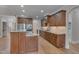 Open concept kitchen features stainless steel appliances, granite countertops, and a large island at 659 Willard Dr, Creedmoor, NC 27522