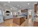 Open kitchen view showcases an island, stainless appliances, and access to the living area at 659 Willard Dr, Creedmoor, NC 27522