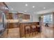 Spacious kitchen boasts an island with seating, granite countertops, and stainless steel appliances at 659 Willard Dr, Creedmoor, NC 27522