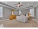 Spacious main bedroom with tray ceiling, carpet flooring, and natural light from double windows at 659 Willard Dr, Creedmoor, NC 27522