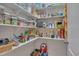 Spacious walk-in pantry with white shelving offers ample storage for food and kitchen supplies at 659 Willard Dr, Creedmoor, NC 27522