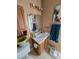 Modest bathroom with single sink vanity, medicine cabinet, and decorative painting at 701 Grandview Drive Dr, Durham, NC 27703