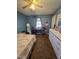 Bedroom featuring a ceiling fan, window, dresser, and personal desk at 701 Grandview Drive Dr, Durham, NC 27703