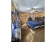Well-lit bedroom with a large bed, a ceiling fan, modern furnishings, and wall decorations at 701 Grandview Drive Dr, Durham, NC 27703