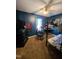 Bedroom with a bunkbed, desk, ceiling fan, and blue walls at 701 Grandview Drive Dr, Durham, NC 27703
