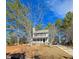 Charming two-story home featuring a front porch and a well-manicured yard on a sunny day at 701 Grandview Drive Dr, Durham, NC 27703