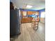 Functional kitchen featuring wood cabinets, ample counter space, and modern appliances on tile floor at 701 Grandview Drive Dr, Durham, NC 27703