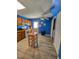 View of a kitchen featuring wooden cabinets, a ceiling fan, and a door leading to the outdoors at 701 Grandview Drive Dr, Durham, NC 27703