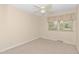 Bedroom with ceiling fan, window and neutral carpet at 714 W J St, Erwin, NC 28339