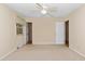 Bedroom with ceiling fan, window and two doors at 714 W J St, Erwin, NC 28339