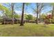 A charming brick home features classic architecture with a lush lawn and a convenient carport for parking at 714 W J St, Erwin, NC 28339