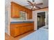 Well-lit kitchen featuring oak cabinets, blue laminate countertops, and a double basin stainless steel sink at 714 W J St, Erwin, NC 28339
