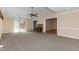 Expansive living room with a brick fireplace, neutral carpet, and a view to other rooms at 714 W J St, Erwin, NC 28339