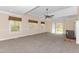 Spacious living room with a brick fireplace, windows, and a sliding glass door to the backyard at 714 W J St, Erwin, NC 28339