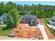 Expansive aerial view of a new home with landscaping in progress, showcasing the property's spacious surroundings at 7412 Wexford Woods Ln, Wake Forest, NC 27587