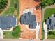 Aerial view of home with a gray roof, spacious backyard, and an in-ground pool under construction at 7412 Wexford Woods Ln, Wake Forest, NC 27587