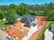 New home aerial view with landscaping in progress, with a focus on its spacious yard and neighborhood at 7412 Wexford Woods Ln, Wake Forest, NC 27587