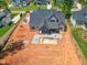 An aerial view of a home's backyard and an in-ground pool under construction at 7412 Wexford Woods Ln, Wake Forest, NC 27587