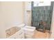 Half bathroom featuring an aqua tiled shower at 7412 Wexford Woods Ln, Wake Forest, NC 27587