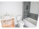 Small bathroom with grey tiled shower and white fixtures at 7412 Wexford Woods Ln, Wake Forest, NC 27587