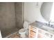 The bathroom has a gray tiled walk-in shower, a toilet, and a sink with drawers at 7412 Wexford Woods Ln, Wake Forest, NC 27587