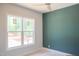Bedroom featuring a two-tone paint design and large windows at 7412 Wexford Woods Ln, Wake Forest, NC 27587
