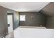 Loft featuring brown accent walls and a window at 7412 Wexford Woods Ln, Wake Forest, NC 27587