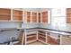 This kitchen features new cabinets and an apron sink with a stainless steel faucet at 7412 Wexford Woods Ln, Wake Forest, NC 27587