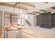 Spacious living room featuring beamed ceilings, a modern fireplace, and large windows offering plenty of natural light at 7412 Wexford Woods Ln, Wake Forest, NC 27587