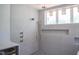Large tiled shower with multi-head fixture and window at 7412 Wexford Woods Ln, Wake Forest, NC 27587