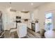 Modern kitchen with white cabinets, stainless steel appliances, and center island at 85 Queenstown Dr # 8, Princeton, NC 27542