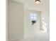 Carpeted bedroom featuring a window that provides ample natural light and neighborhood views at 85 Sunshine Rd # 4, Kenly, NC 27542