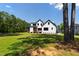 New construction home featuring a large, flat yard and multiple outdoor living spaces at 8621 Bishop Pine Ln, Wake Forest, NC 27587