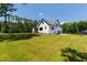 Back exterior of new construction home with large driveway and a spacious backyard with lots of privacy at 8621 Bishop Pine Ln, Wake Forest, NC 27587
