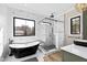 Modern bathroom with geometric tile, freestanding tub, and glass shower at 8621 Bishop Pine Ln, Wake Forest, NC 27587