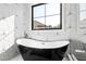 Close-up of the modern black and white bathtub at 8621 Bishop Pine Ln, Wake Forest, NC 27587