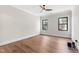 Bright bedroom features hardwood floors, neutral walls, and a modern ceiling fan at 8621 Bishop Pine Ln, Wake Forest, NC 27587