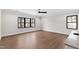 Bright bedroom features hardwood floors, neutral walls, and modern ceiling fan at 8621 Bishop Pine Ln, Wake Forest, NC 27587