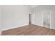 Bedroom features hardwood floors and doorways to other rooms at 8621 Bishop Pine Ln, Wake Forest, NC 27587