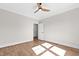 This bedroom boasts wood flooring, a modern ceiling fan and lots of natural light at 8621 Bishop Pine Ln, Wake Forest, NC 27587