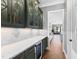 This butler's pantry features custom cabinets, ample counterspace and a beverage fridge at 8621 Bishop Pine Ln, Wake Forest, NC 27587