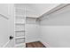 A closet with wooden racks for hanging garments and shelving for folded clothes at 8621 Bishop Pine Ln, Wake Forest, NC 27587